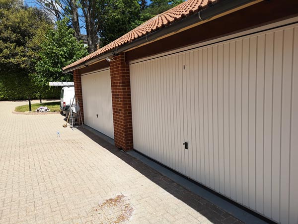 Painting Garage Doors on Block of Flats in Sandbanks - After Photo - Frampton and Sons Bournemouth